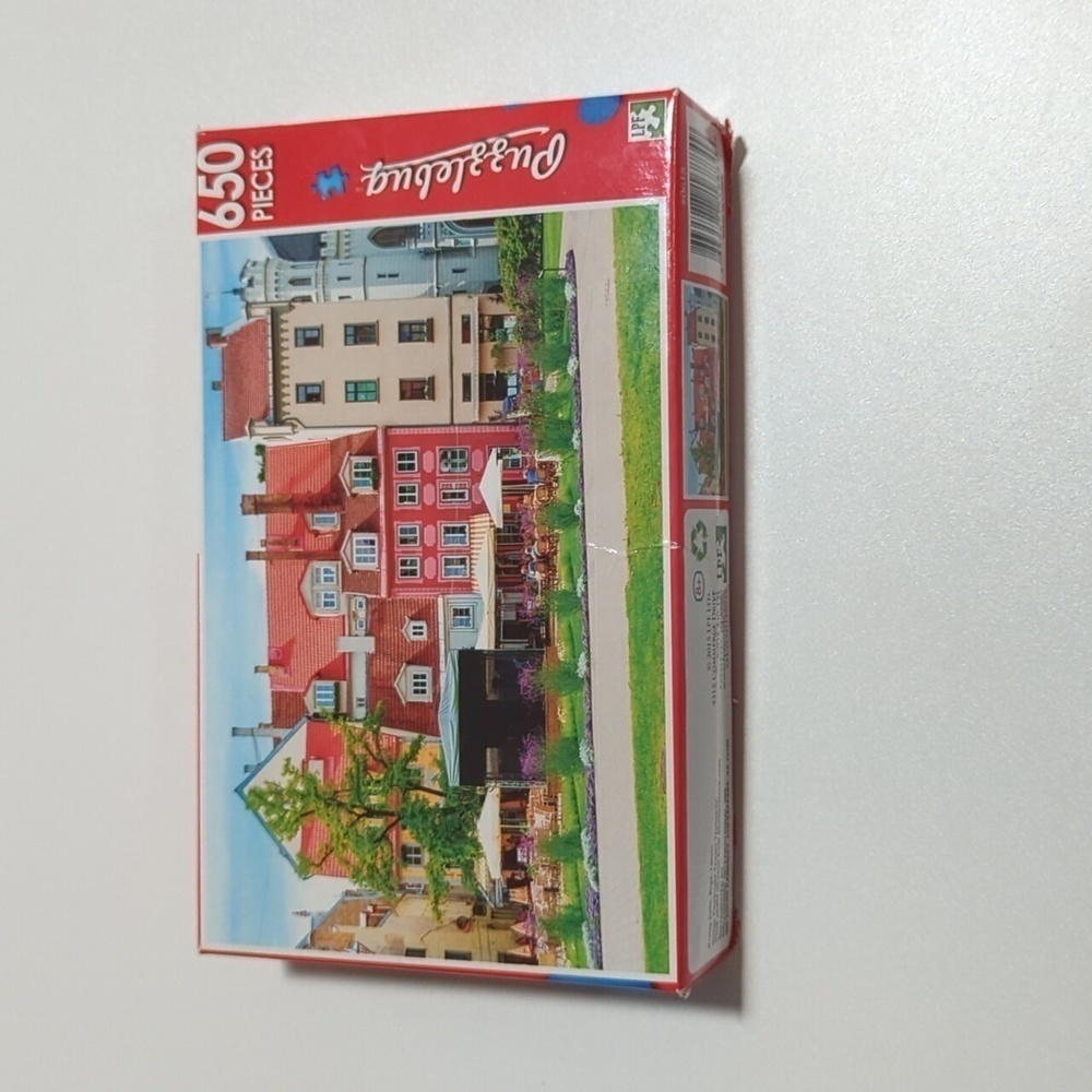Puzzlebug 650 pc. Jigsaw Puzzle - Pretty Cafe Riga, Latvia Used